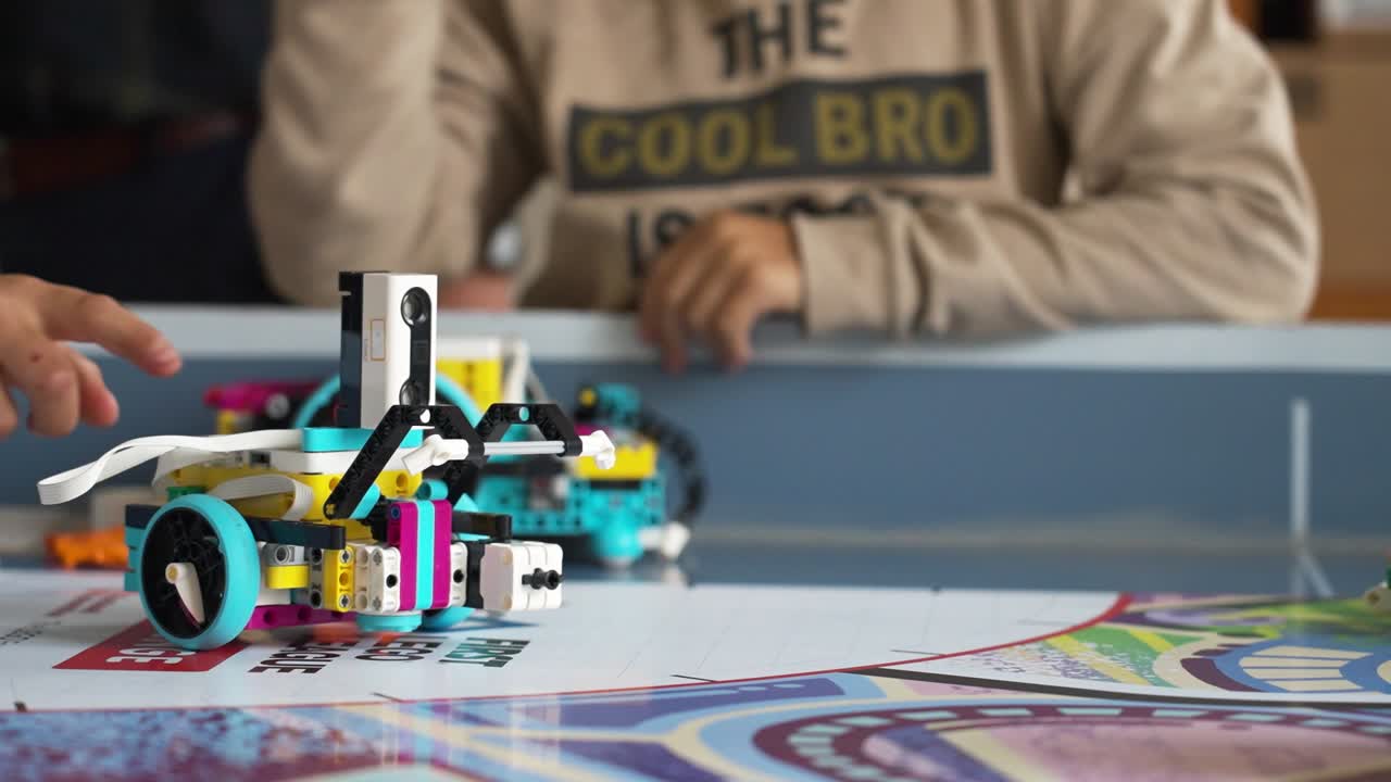 Robot on table while kids interact