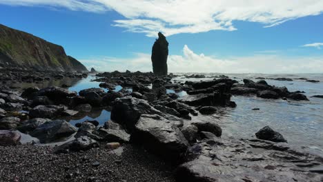 Timelapse-imposing-sea-stack-and-oncoming-waves-on-a-rocky-beach-at-Ballydwane-Beach-Copper-Coast-Waterford-Ireland