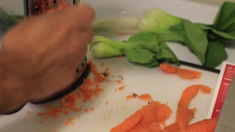 peeling carrots on a cutting board