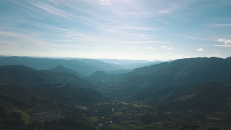 Drone-aerial,-high-angle-wide-view-of-beautiful-landscape-with-mountains-and-hills-in-Colombia