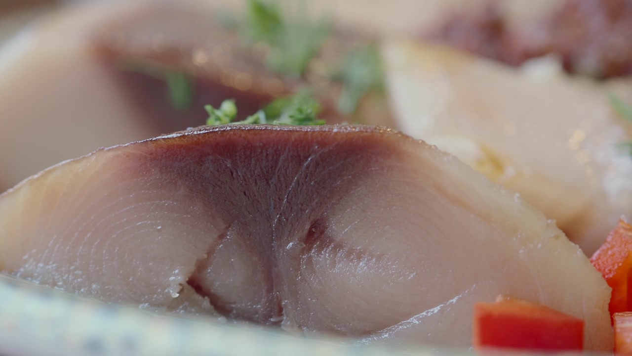 Pickled Fish Fillet Garnished with Herbs and Diced Bell Pepper