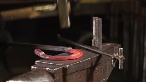 blacksmith working on a horseshoe