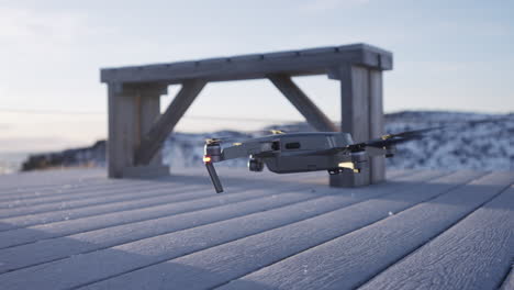 drone performing taking off in winter landscape