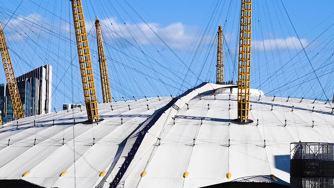 Closeup Time lapse of The O2 Arena, formerly known as the Millennium Dome,  with tourist on the upper deck.