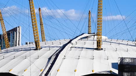 closeup time lapse of the o2 arena, formerly known as the millennium dome,  with tourist on the upper deck.