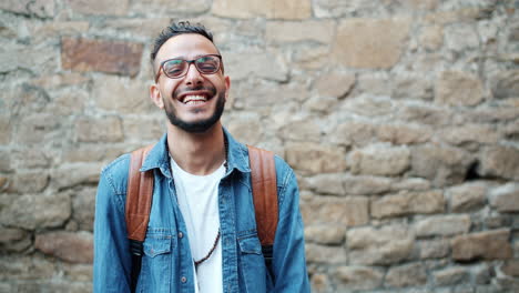 smiling man with backpack