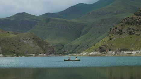 couple kayaking on a mountain lake