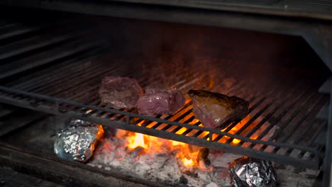 picanha and top sirloin steak beef american over grid grill charcoal oven fire flames marble premium meat raw barbecue