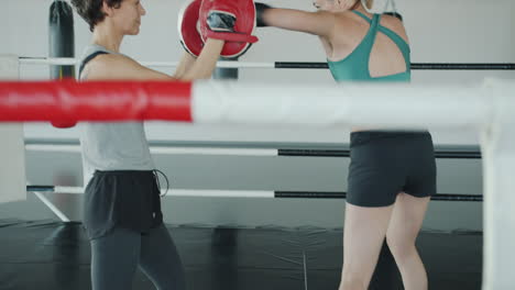 women boxing training session