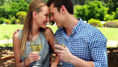 Couple-interacting-with-each-other-while-having-glasses-of-wine-4k