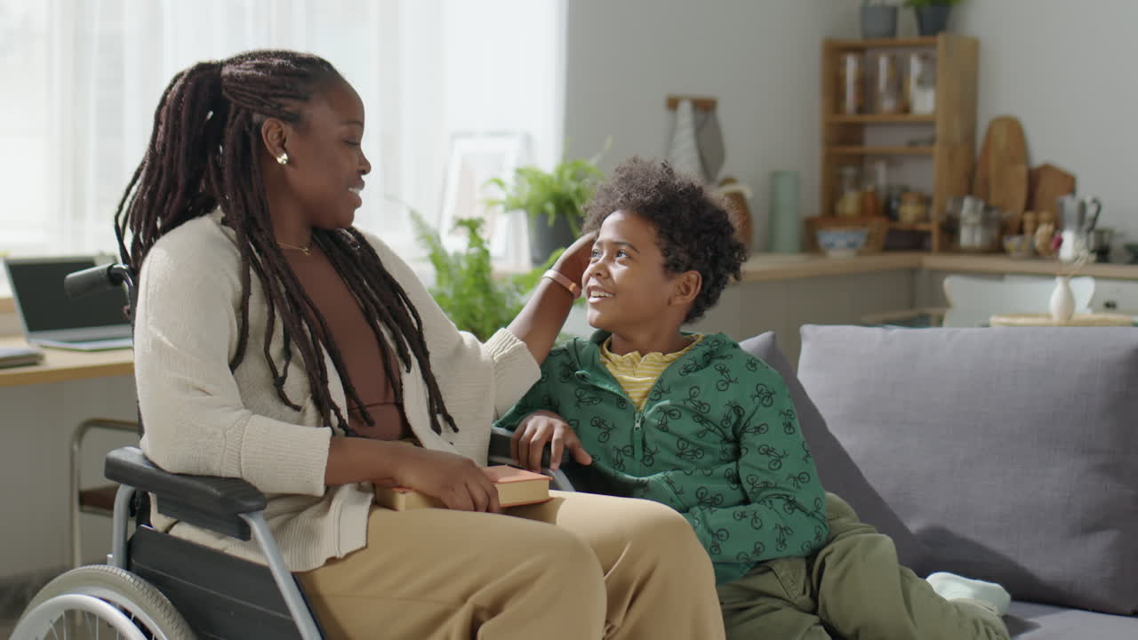 Mother in Wheelchair Bonding with Son at Home
