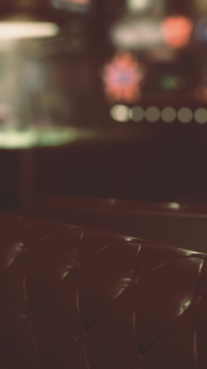 Cozy bar interior with dim lighting and leather seating for evening relaxation