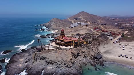 travel vacation developments along oceanfront rocky shoreline with white sandy beaches