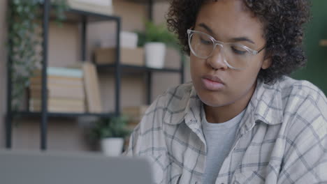 young woman working on laptop