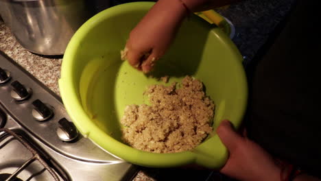 person in the kitchen at home preparing quinoa