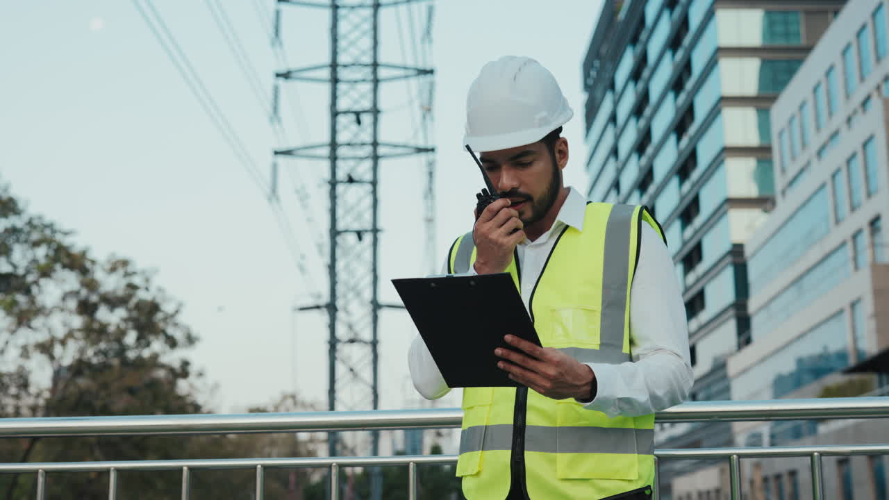 Construction worker checking electrical equipment