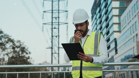construction worker checking electrical equipment