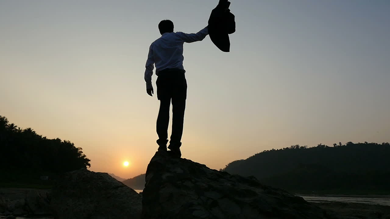 Businessman enjoying sunset view