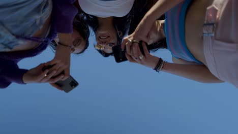 friends looking at smartphones