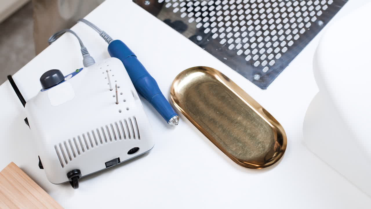 Nail Technician Using Drill in Salon