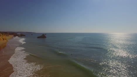 Surfing-at-the-beach-of-Portimao,-Portugal