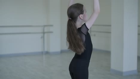 young ballet girl at studio lesson. training performance. stretching exercise pose. ballerina practice balance technique. classical elegance fitness.