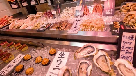 variety of seafood displayed at a busy market