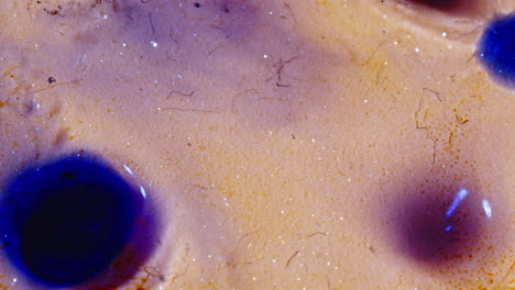 abstract colorful macro texture with glitter and dye