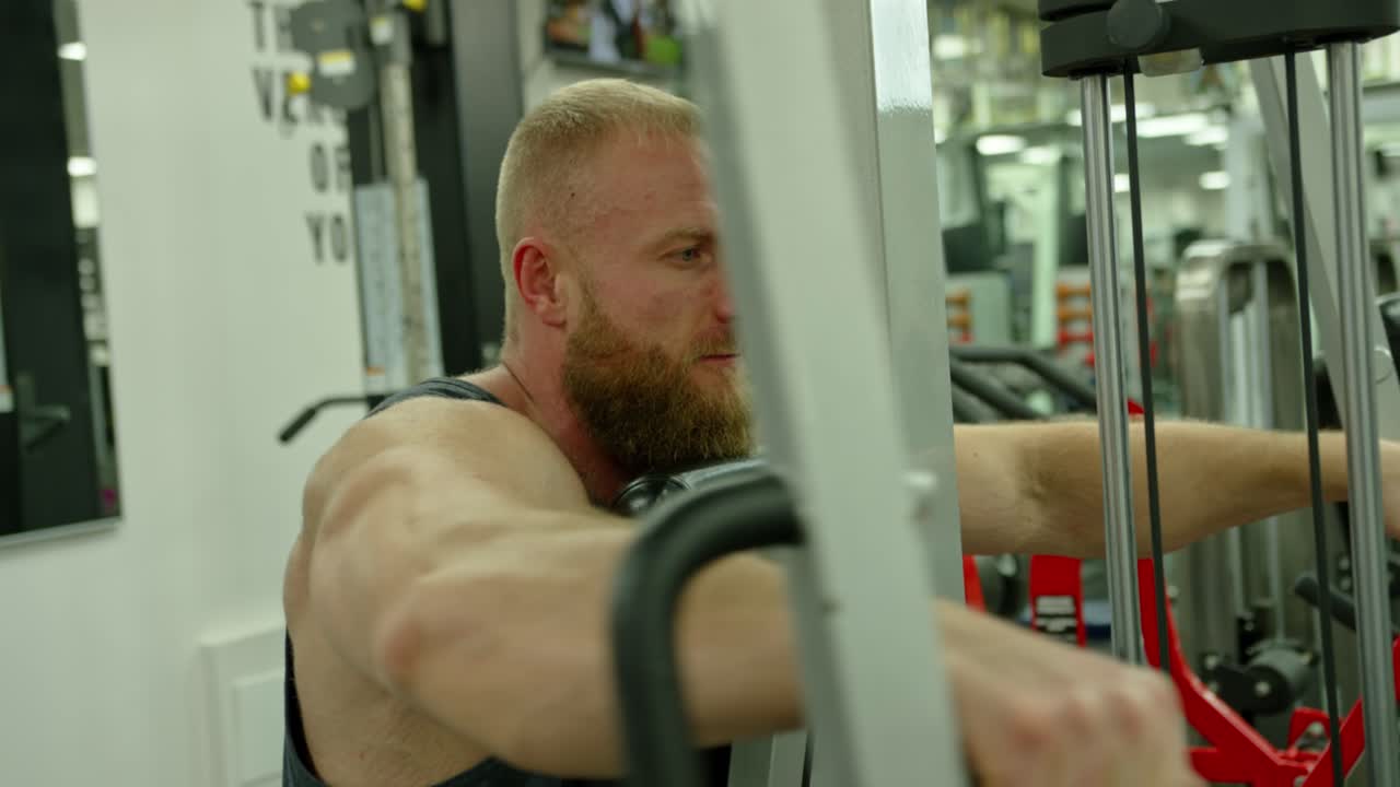 Strong bodybuilder lifting weights. Athletic person effort