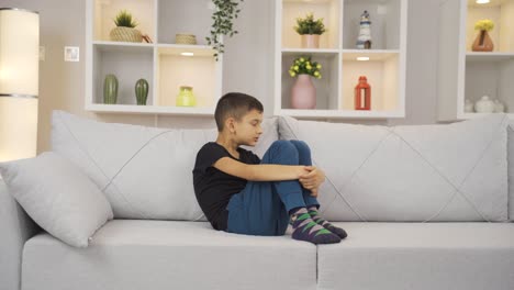 boy with family problems is thoughtful.