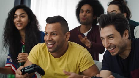 group of friends having fun while playing a game console