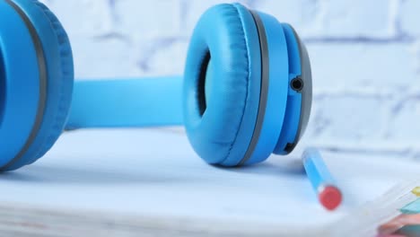 blue headphones on a notebook