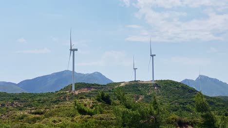 Masts-of-wind-power-plants-on-wild-nature-hills-in-Aegean-Turkey,-Datça-province