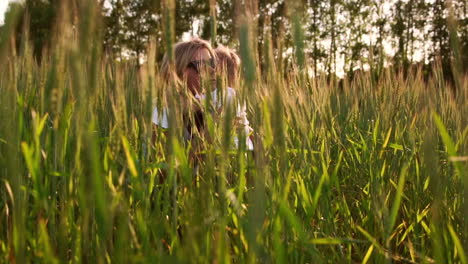 loving mother and son in the field to communicate and hug, the sun's rays illuminate the hair. happy family