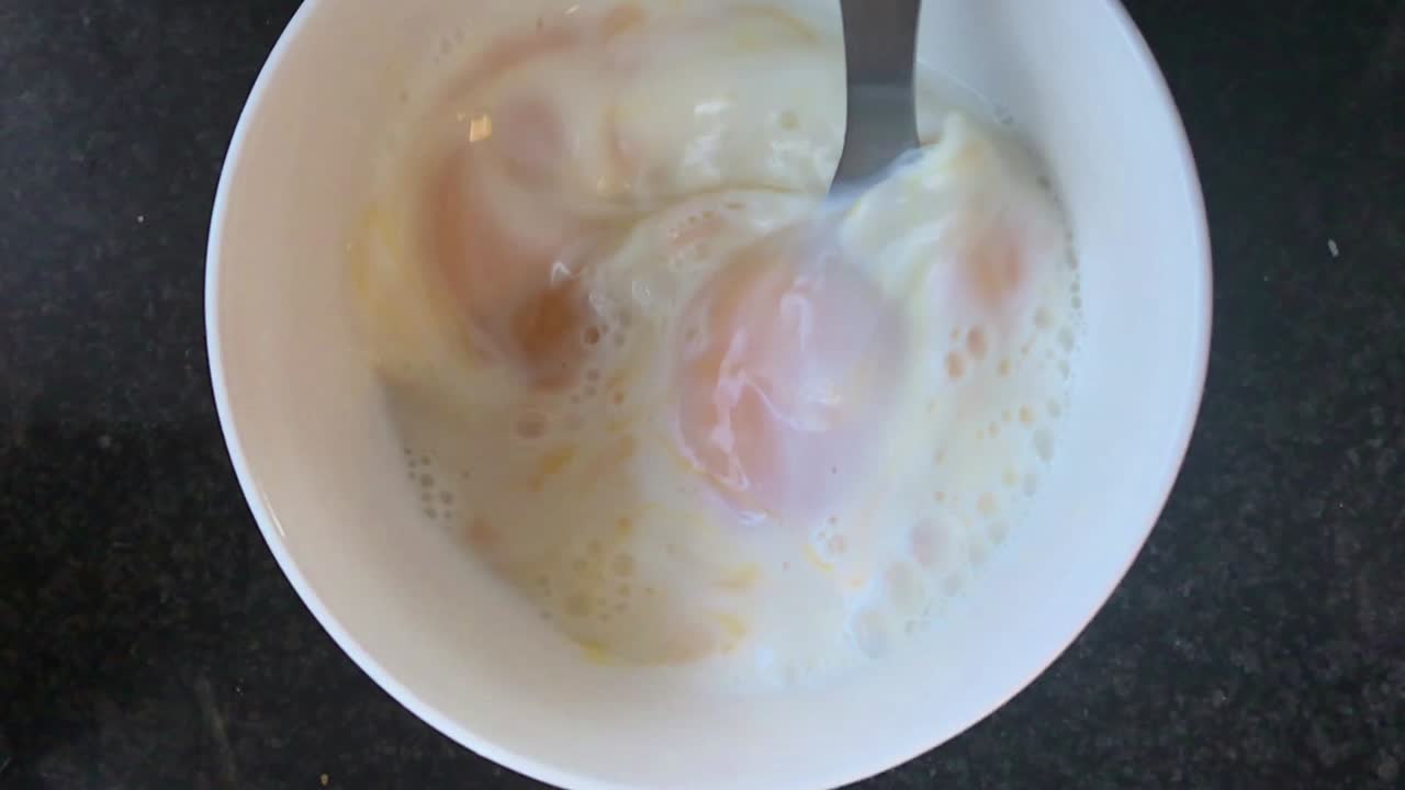 Eggs busy stirred in a bowl