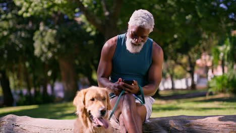 man with golden retriever in park