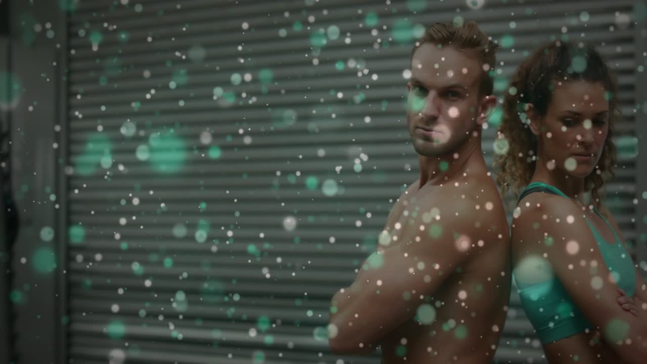 Camera roll starting fitness duo posing back-to-back in garage for promo bokeh drifting and hiding