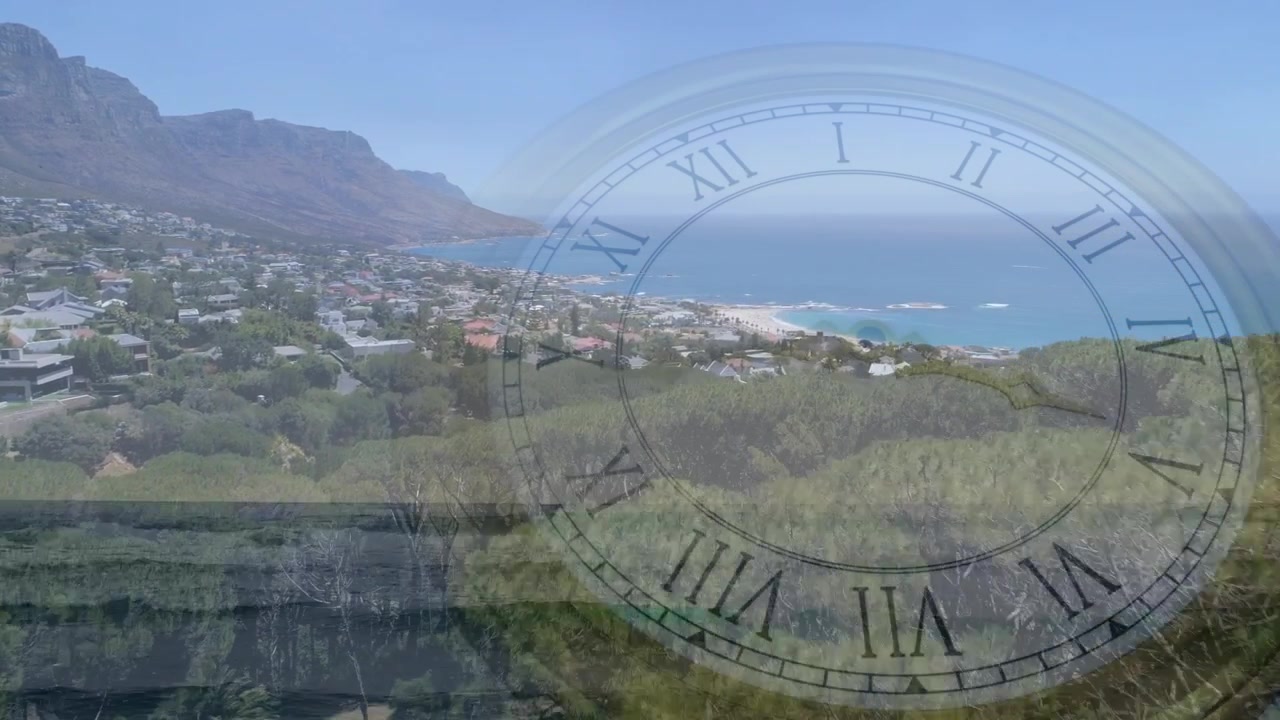 Vista che si sposta a destra inquadrando una collina con un orologio imponente a numeri romani con lancette che ruotano, segnando il tempo.