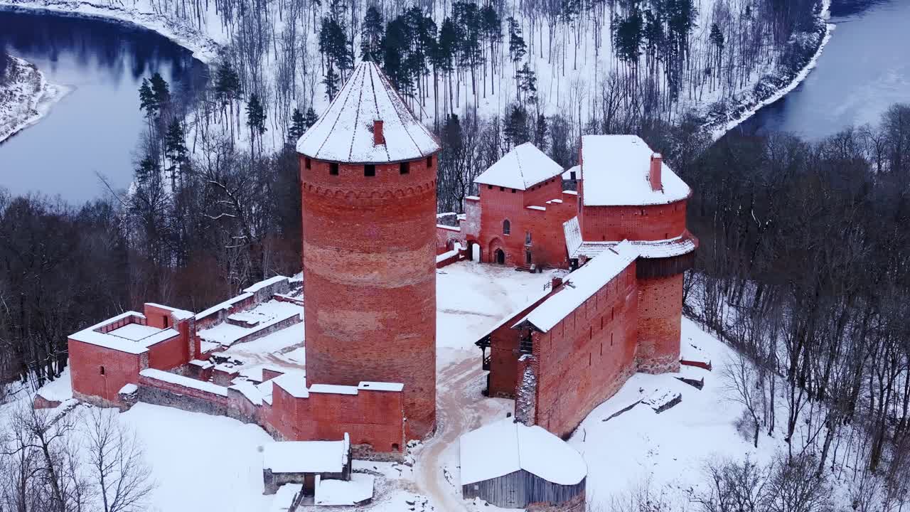 Snow covered Turaida castle in Latvia represents medieval heritage and history