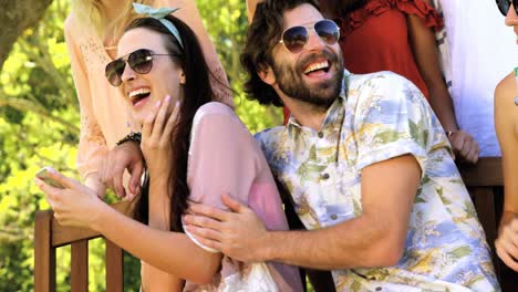 Portrait-of-a-group-of-hipster-friends-sitting-and-laughing