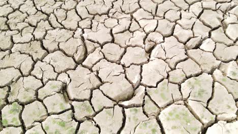 cracked land because of drought, aerial ascend view