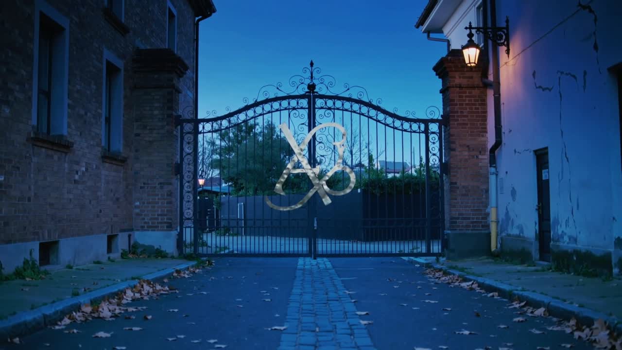 Camera centering wrought-iron gate capturing metal monogram at dusk in narrow lane, filming entry