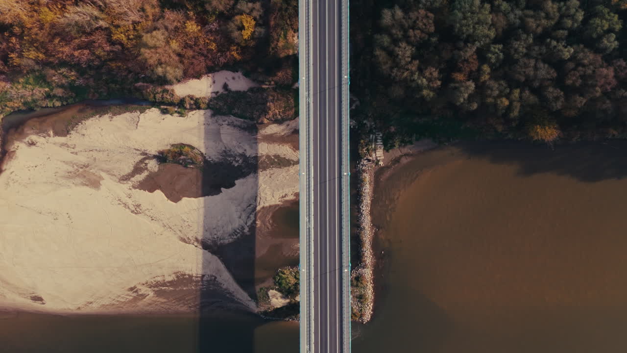 Aerial View of Bridge over River with Autumnal Trees
