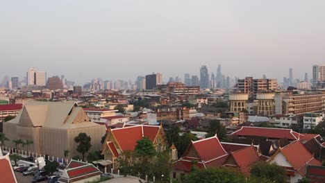 View-on-Bangkok-city-from-Golden-Mountain-Temple,-Wat-Saket-in-Thailand,-at-sunset-time,-South-East-Asia