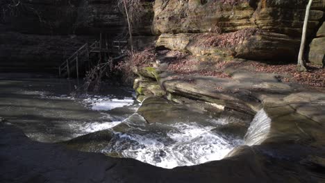 majestic small rocky waterfall in stone valley in static view