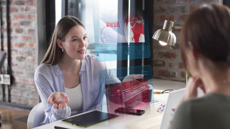 animation of digital screens with data over caucasian female colleagues talking in office