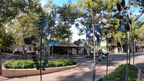 Multiple-copper-wind-sculptures-twist-and-turn-in-the-breeze,-Sedona,-Arizona