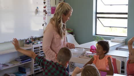 female teacher teaching kids in the class