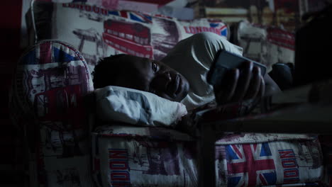 a man laying on a couch