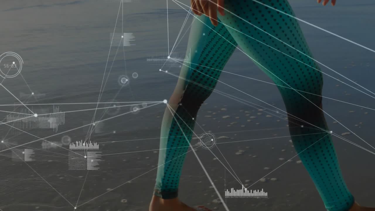 Woman stepping into shallow seawater wearing teal leggings powering live fitness tracking overlay